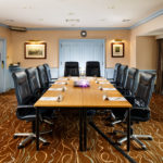 The Boardroom at Mercure Livingston Hotel, set up for a meeting, projector