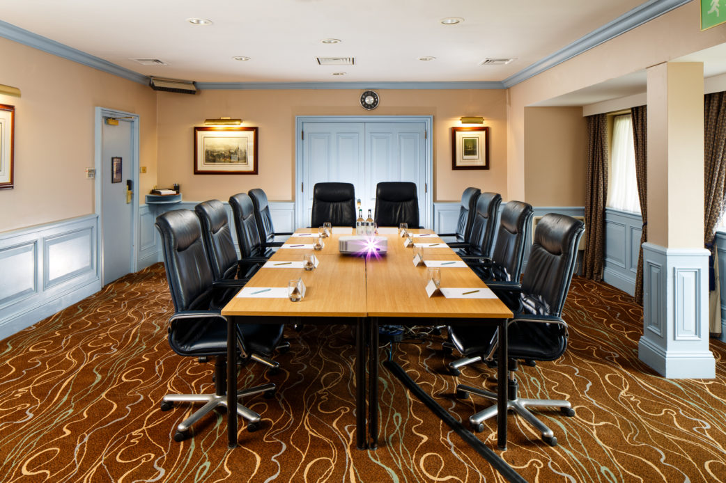 The Boardroom at Mercure Livingston Hotel, set up for a meeting, projector