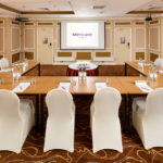 The Burn Suite at Mercure Livingston Hotel, set up for a meeting, projector screen