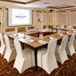 The Burn Suite at Mercure Livingston Hotel, set up for a meeting, projector screen
