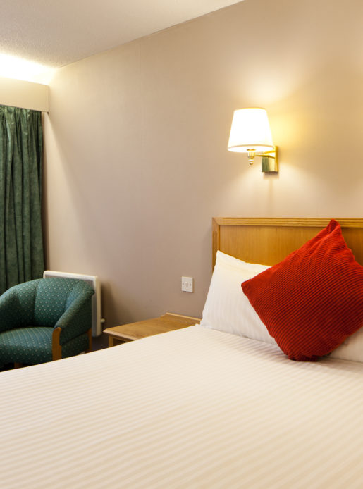 Classic double bedroom at Mercure Livingston Hotel, double bed, armchair, side table