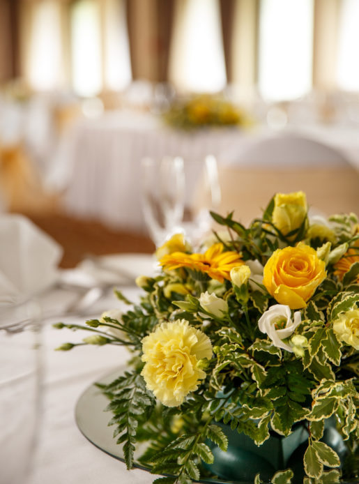 Yellow flower centrepiece, wedding breakfast