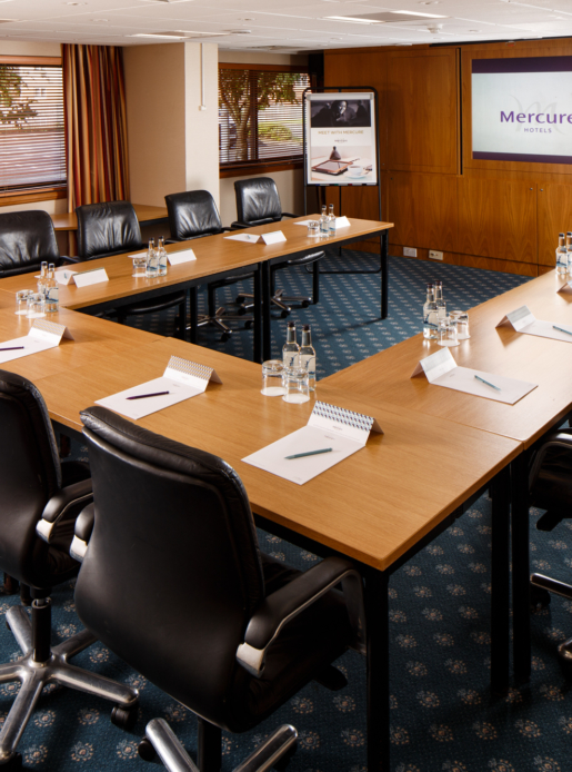 The Summit Suite at Mercure Livingston Hotel, set up for a meeting, leather chairs