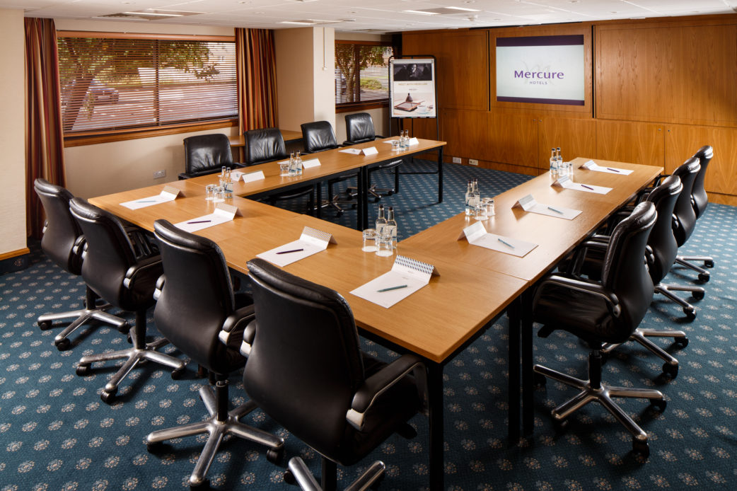 The Summit Suite at Mercure Livingston Hotel, set up for a meeting, leather chairs